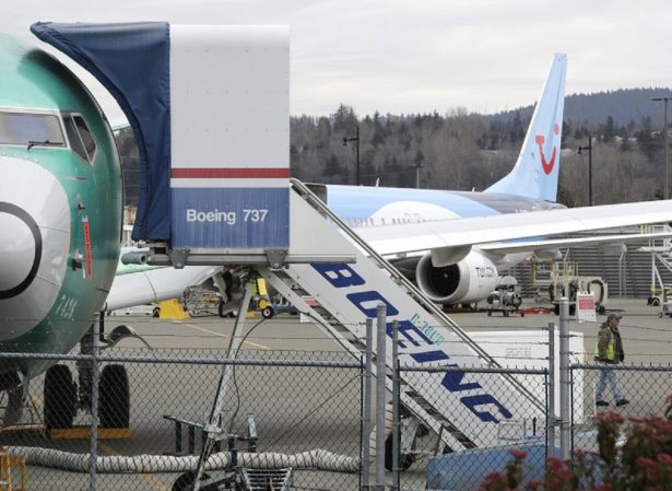A Boeing 737 MAX 8 airplane being built for TUI Group sits parked in the background at right at Boeing Co.'s Renton Assembly Plant in Renton, Wash., on March 11, 2019. (Ted S. Warren/AP Photo)