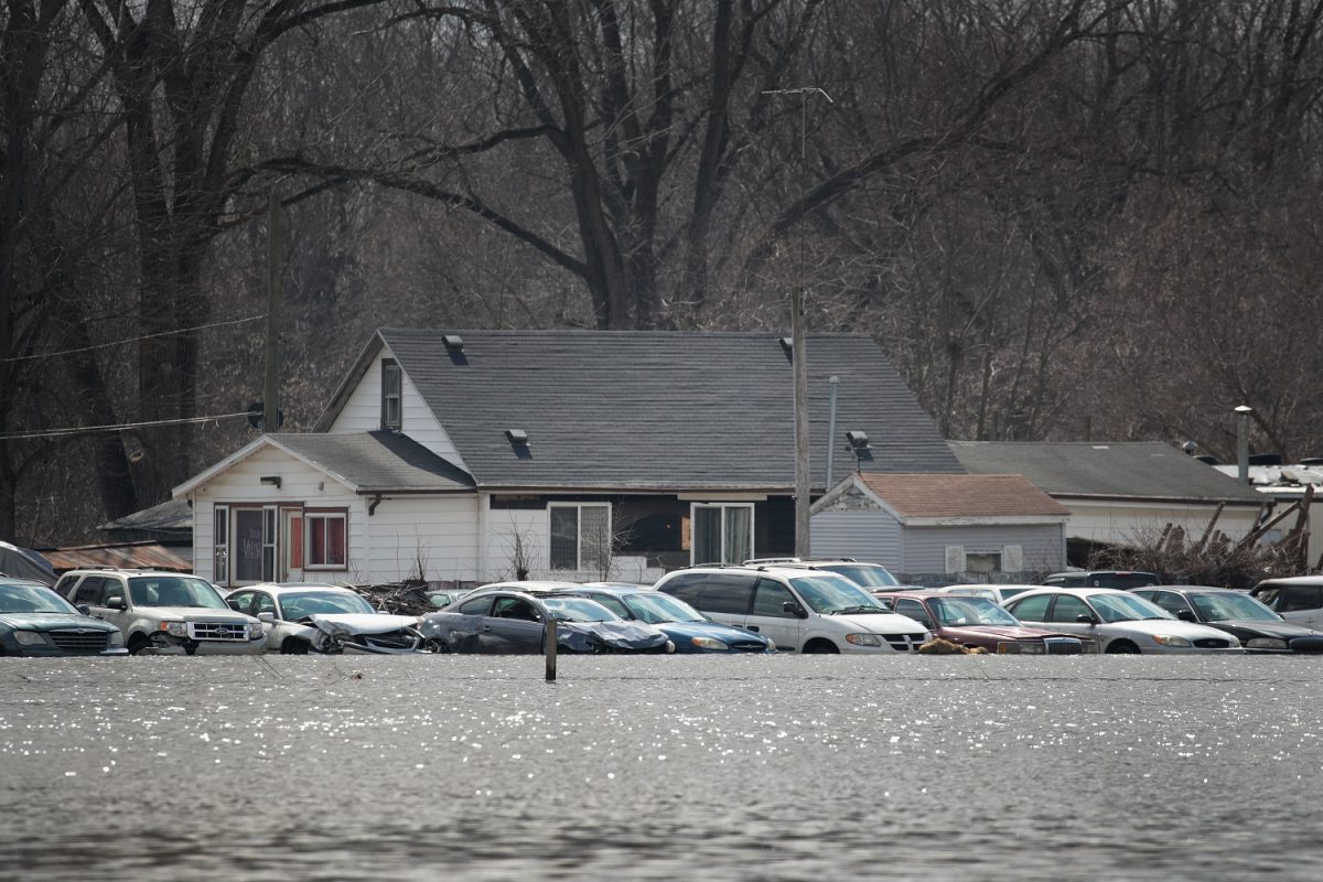 Cars sit in floodwater from the Pecatonica River in Freeport, Illinois, on March 18, 2019. (Scott Oslon/Getty Images)
