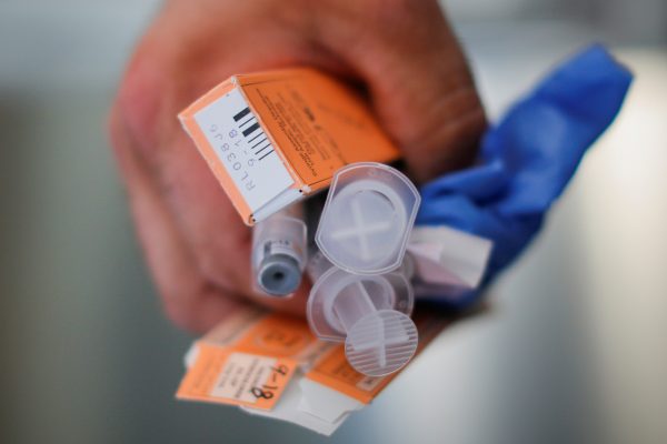 In this photo (not directly related to the story) a medic holds used doses of a dangerous drug after medics revived a man who had overdosed. (Brian Snyder/Reuters)