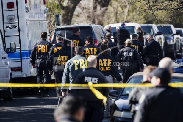 Authorities work on the scene of an explosion in Austin, Texas. March 12, 2018. (Ricardo B. Brazziell/Austin American-Statesman via AP)