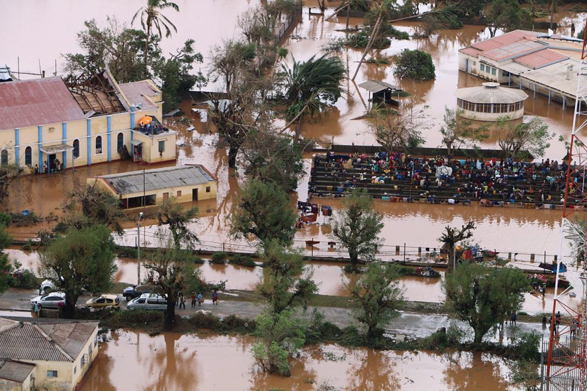 Residents gather stranded on the stands of a stadium in a flooded area of Buzi, central Mozambique, on March 20, 2019. (Adrien Barbier/AFP/Getty Images)