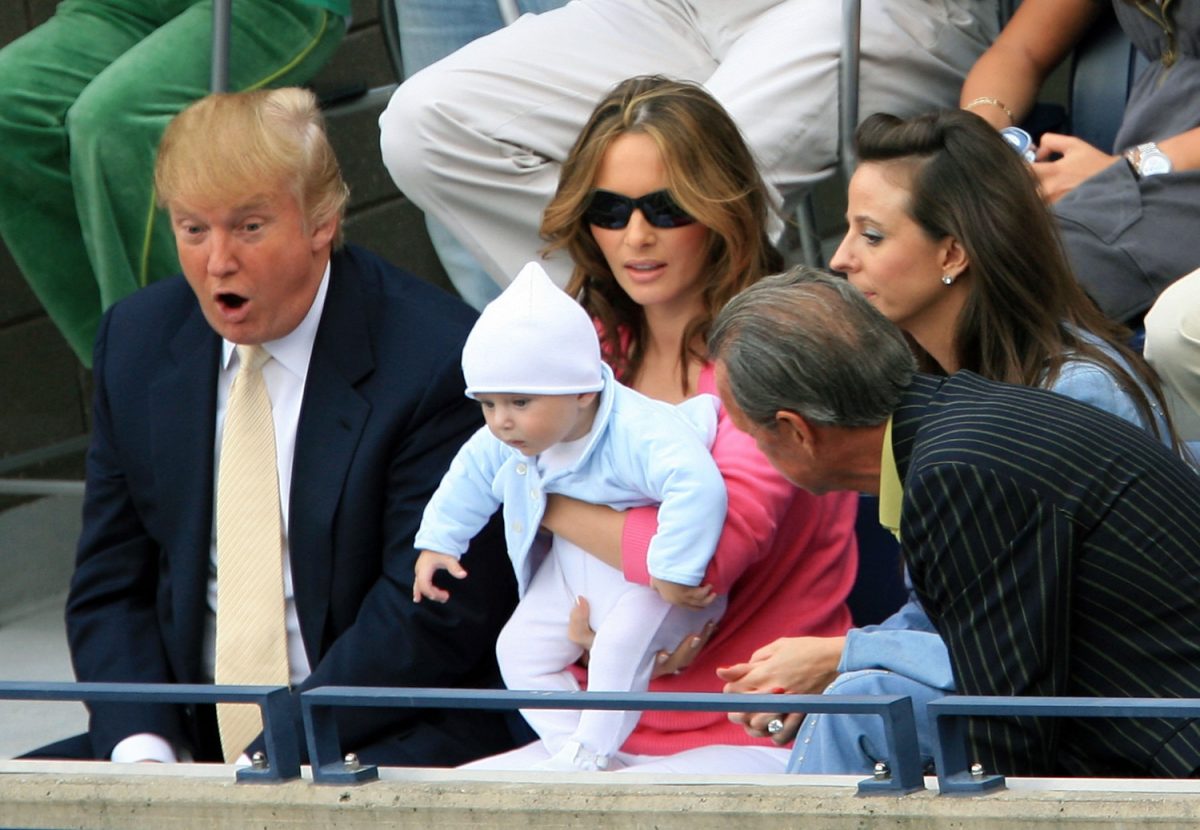 Donald Trump, baby son Barron and wife Melania Trump watch the men's final between Roger Federer of Switzerland and Andy Roddick during the U.S. Open at the USTA Billie Jean King National Tennis Center in Flushing Meadows Corona Park in the Flushing neighborhood of the Queens borough of New York City on Sept. 10, 2006 (Jamie Squire/Getty Images)