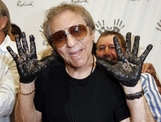 Hal Blaine holds up his hands covered in cement after placing them in wet cement with Don Randi and Glen Campbell, representing The Wrecking Crew following an induction ceremony for Hollywood's RockWalk in Los Angeles, on June 25, 2008. (Kevork Djansezian, AP Photo/File)