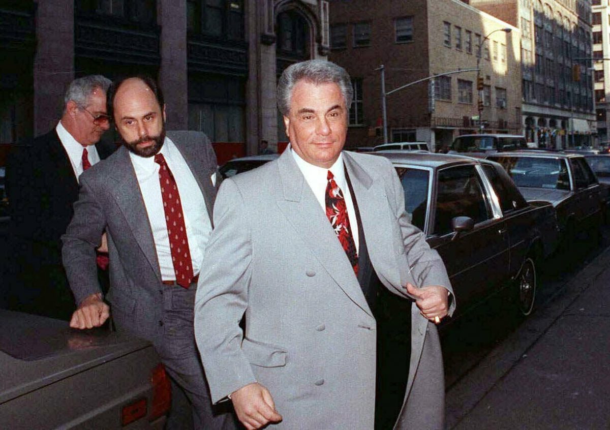 John Gotti, right, arrives at court in New York on Feb. 9, 1990. The Gambino family was once among the most powerful criminal organizations in the U.S., but federal prosecutions in the 1980s and 1990s sent Gotti and other top leaders to prison, diminishing its reach. (David Cantor/AP Photo, File)