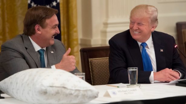President Donald Trump meets with Mike Lindell (L), founder of My Pillow, during a Made in America event with US manufacturers in the East Room of the White House in Washington, on July 19, 2017. (Saul Loeb/AFP/Getty Images)