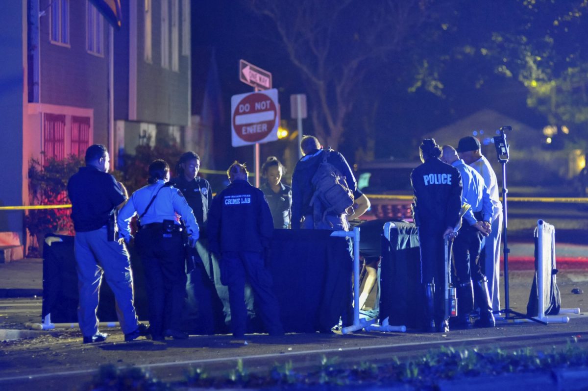 New Orlean Police Department officers process the scene at a fatal hit and run accident along Esplanade Avenue in Bayou St. John in New Orleans, on March 2, 2019. (Shawn Fink/The Advocate via AP)