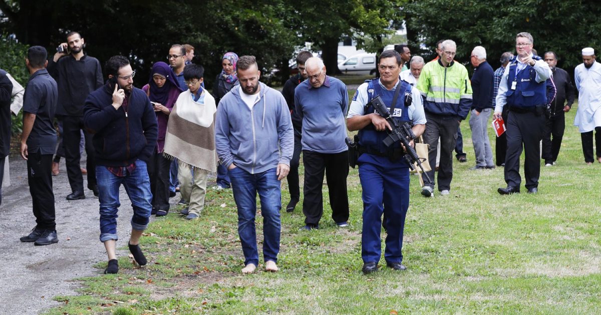 Police escort witnesses away from a mosque in central Christchurch, New Zealand on March 15, 2019. (Mark Baker/AP)