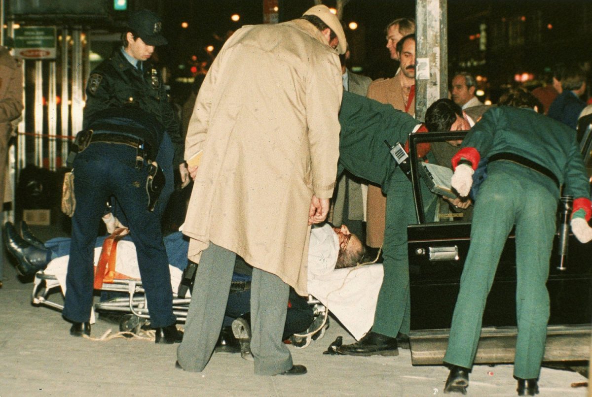 The body of mafia crime boss Paul Castellano lies on a stretcher outside the Sparks Steak House in New York after he and his bodyguards were gunned down at the direction of John Gotti, who then took over as boss on Dec. 16, 1985. (Mario Suriani/AP Photo, File)