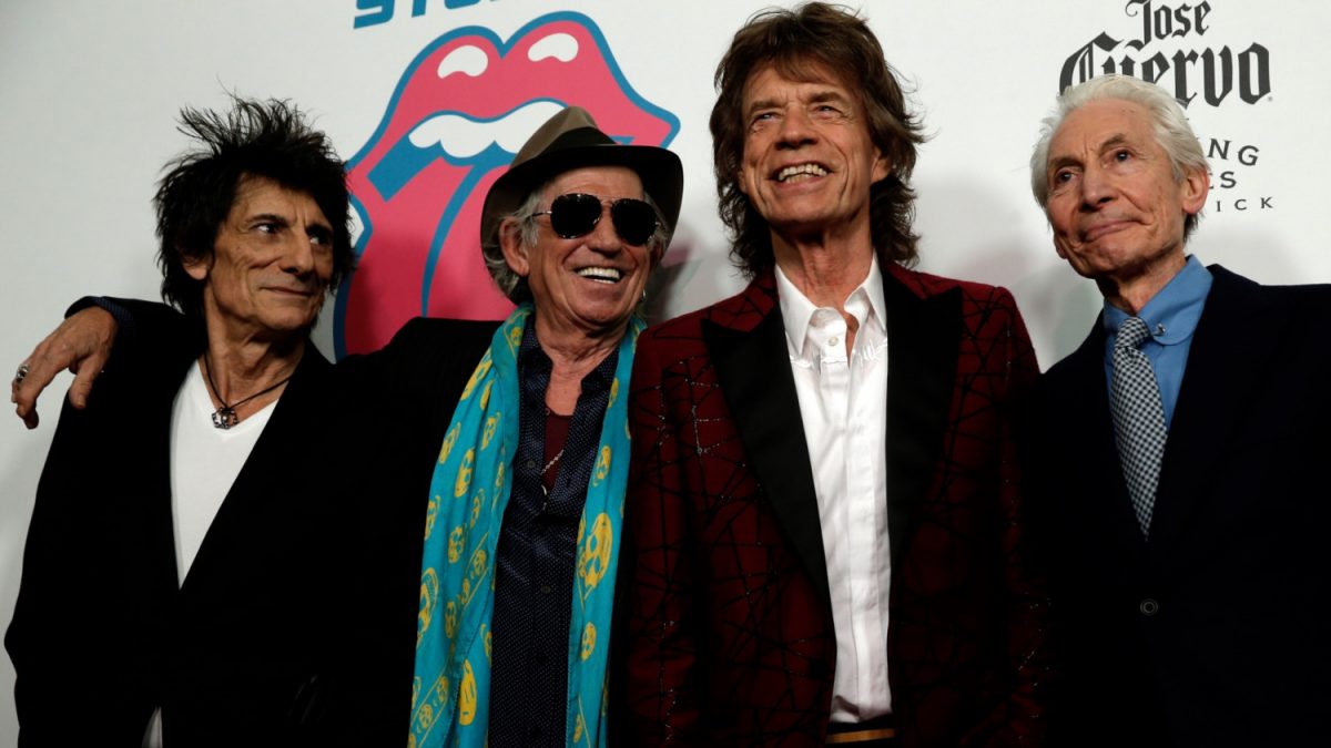 The Rolling Stones (from L-R) Ronnie Wood, Keith Richards, Mick Jagger, and Charlie Watts pose as they arrive for the opening of the new exhibit "Exhibitionism: The Rolling Stones" in the Manhattan, on Nov. 15, 2016. (Mike Segar/Reuters)