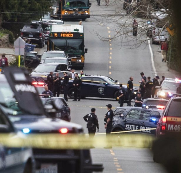 Investigators work at the scene of a shooting in Seattle on March 27, 2019. (Gene Johnson/AP Photo)