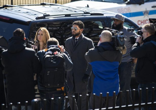 "Empire" actor Jussie Smollett, center, arrives at Leighton Criminal Court Building for a hearing on March 12, 2019, in Chicago. (Ashlee Rezin/Chicago Sun-Times via AP)
