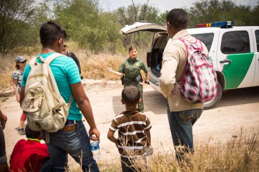 Marlene Castro, supervisory Border Patrol agent, speaks to a group of unaccompanied minors and also two men who crossed the Rio Grande River from Mexico into the United States in Hidalgo County, Texas, on May 26, 2017. (Benjamin Chasteen/The Epoch Times)