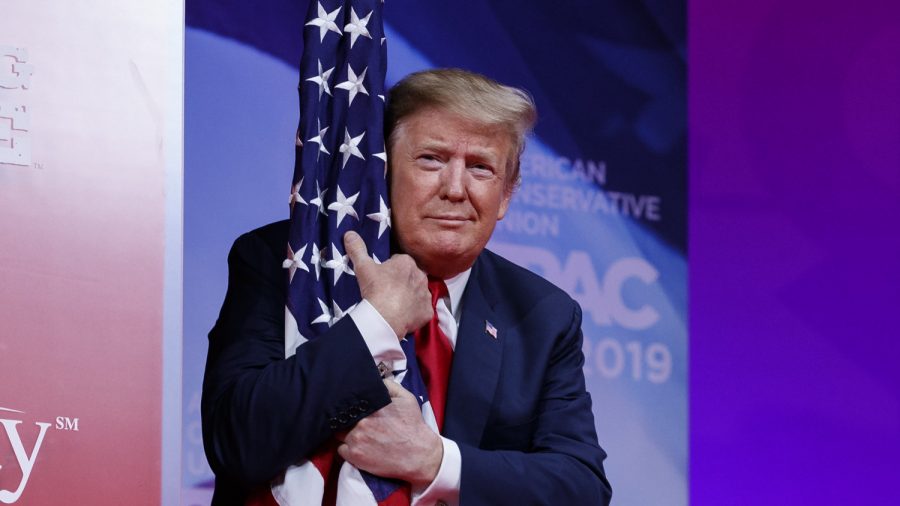 President Trump Hugs American Flag at Conservative Conference