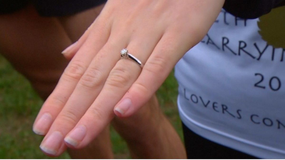 Tanisha Prince's partner, Chris Hepworth surprised her with a marriage proposal as he revealed an engagement ring after they were announced as victors in Britain's annual 'Wife Carrying Championship' race in Dorking, UK, on March 3, 2019. (Screenshot/Reuters)