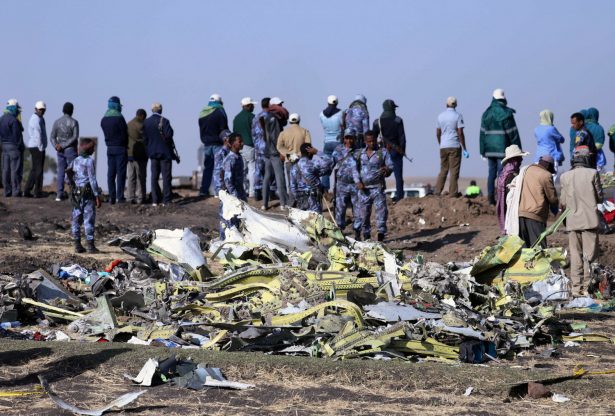 Ethiopian Federal policemen stand at the scene of the Ethiopian Airlines Flight ET 302 plane crash, near the town of Bishoftu, southeast of Addis Ababa, Ethiopia on March 11, 2019. (Tiksa Negeri/Reuters)