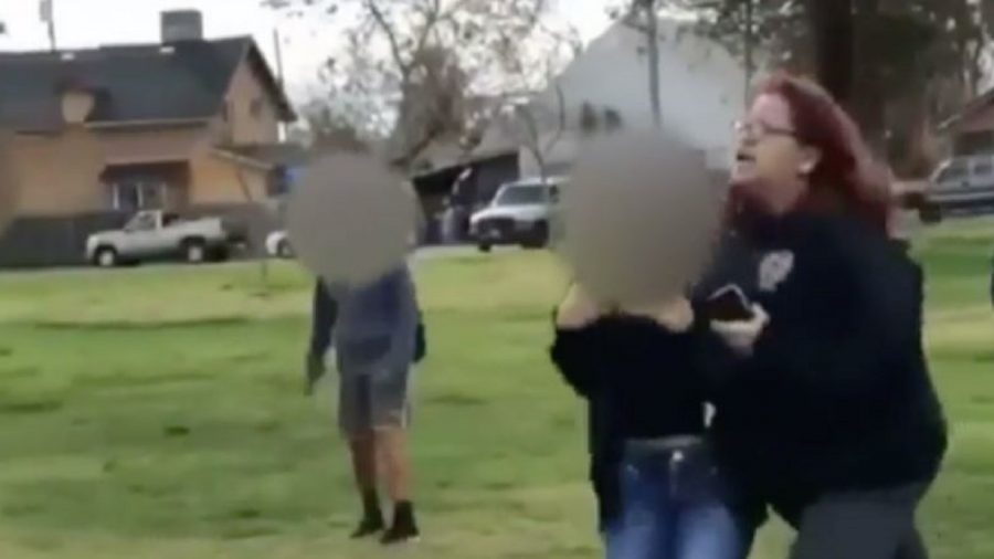 Woman Arrested After Video Showed Her Holding Girl, Encouraging Daughter to Strike