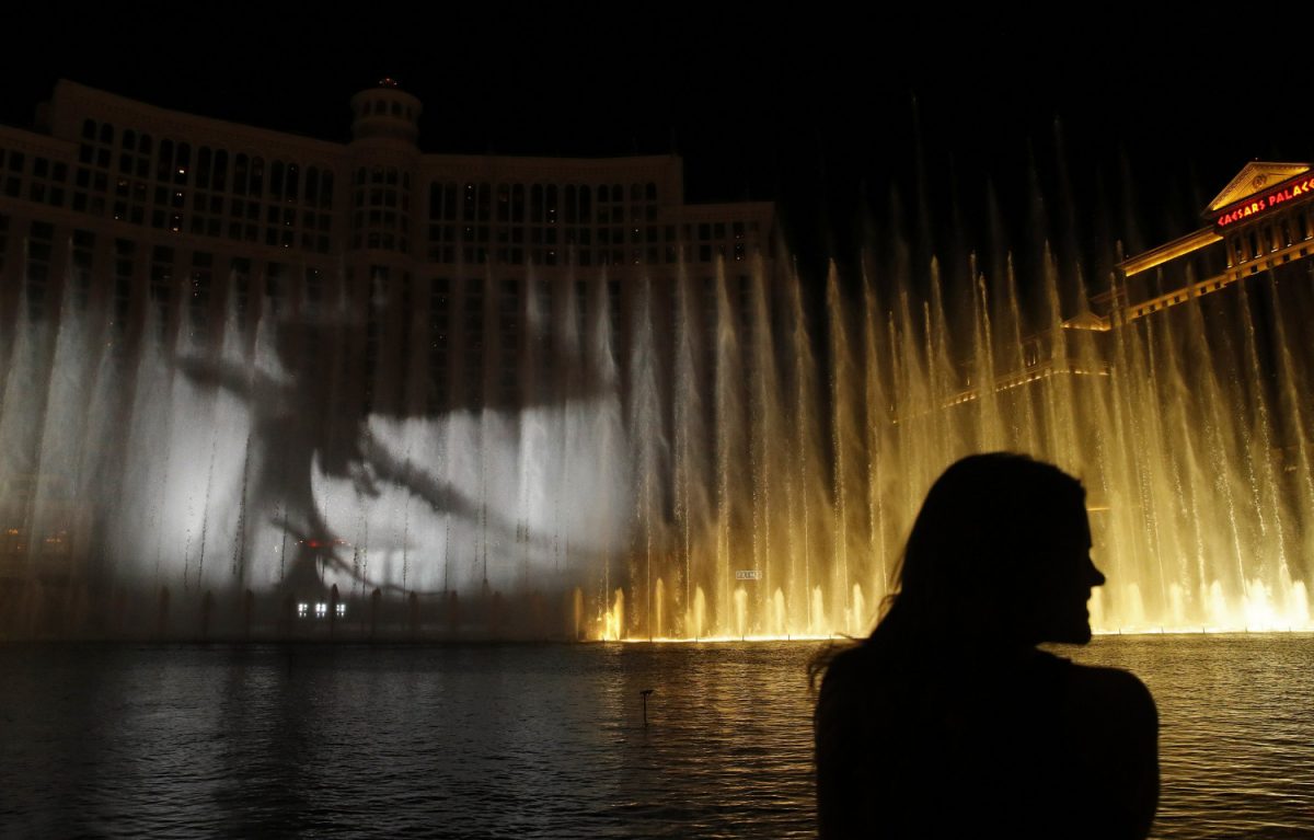 A woman watches during a "Game of Thrones"-themed show at the fountains in Las Vegas, on March 31, 2019. (John Locher/AP photo)