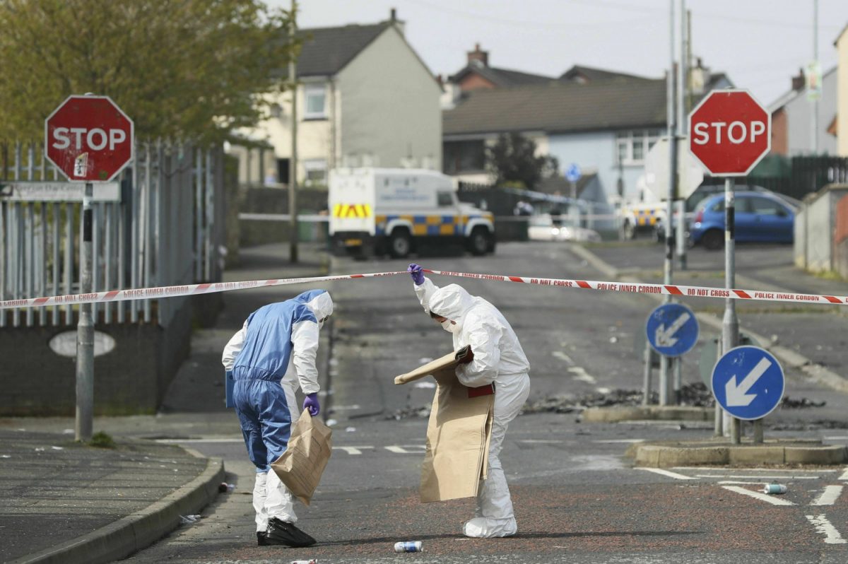 Police forensic officers at the scene in Londonderry, Northern Ireland on April 19, 2019, following the death of 29-year-old journalist Lyra McKee who was shot and killed during overnight rioting. (Brian Lawless/PA via AP)