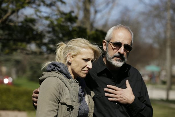 JoAnn Cunningham, the mother of missing 5-year-old child Andrew "AJ" Freund, stands with her attorney George Killis outside of the Freund home in Crystal Lake, Ill., on April 19, 2019. (Stacey Wescott/Chicago Tribune via AP)