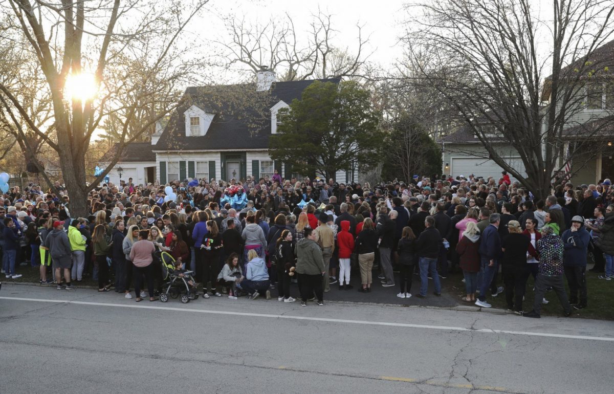 Mourners gather outside the home of 5-year-old Andrew "AJ" Freund for a vigil Wednesday, in Crystal Lake, Ill., on April 24, 2019. (John J. Kim/Chicago Tribune via AP)