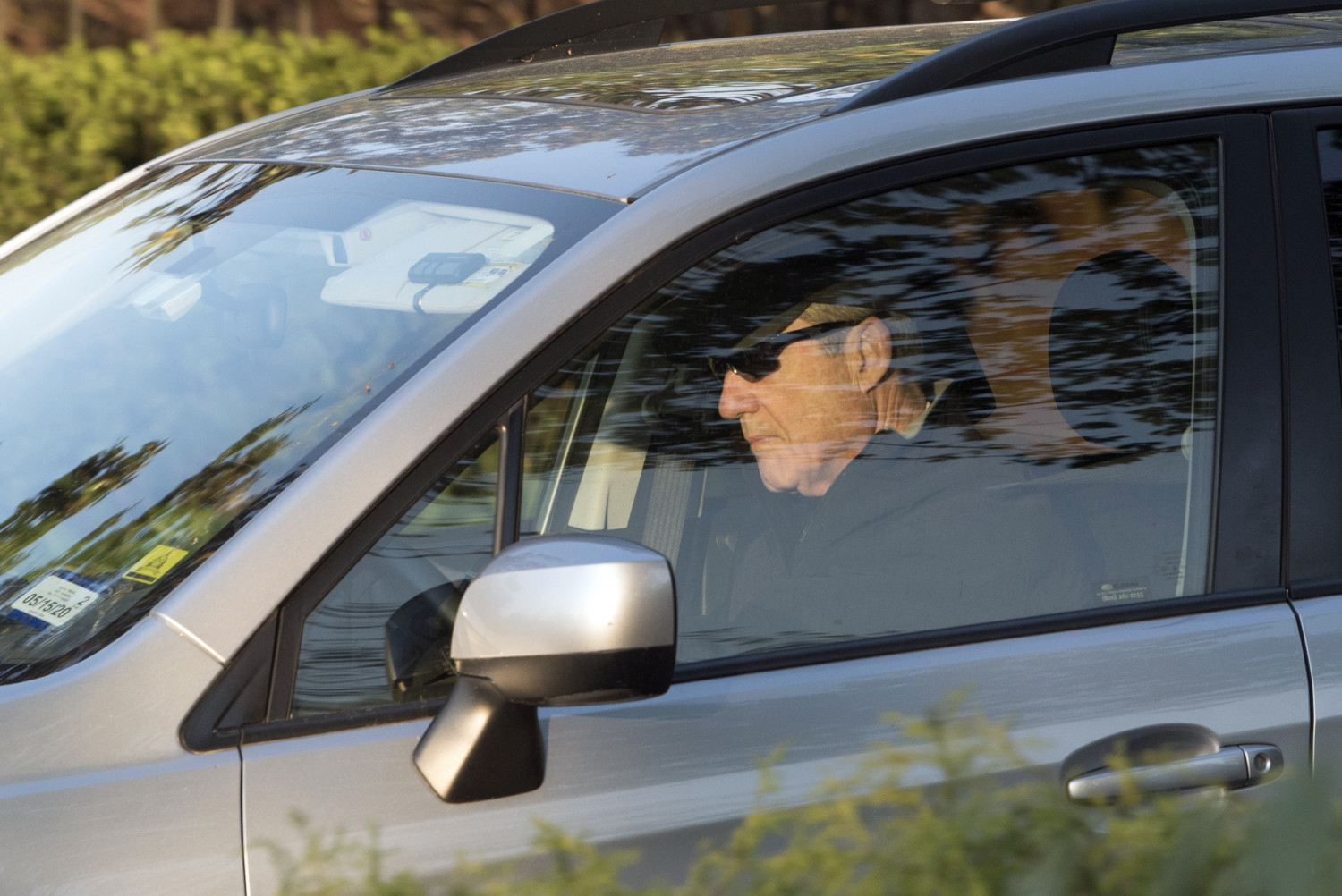 Special Counsel Robert Mueller drives away from his Washington home on April 17, 2019. (AP Photo/Kevin Wolf)