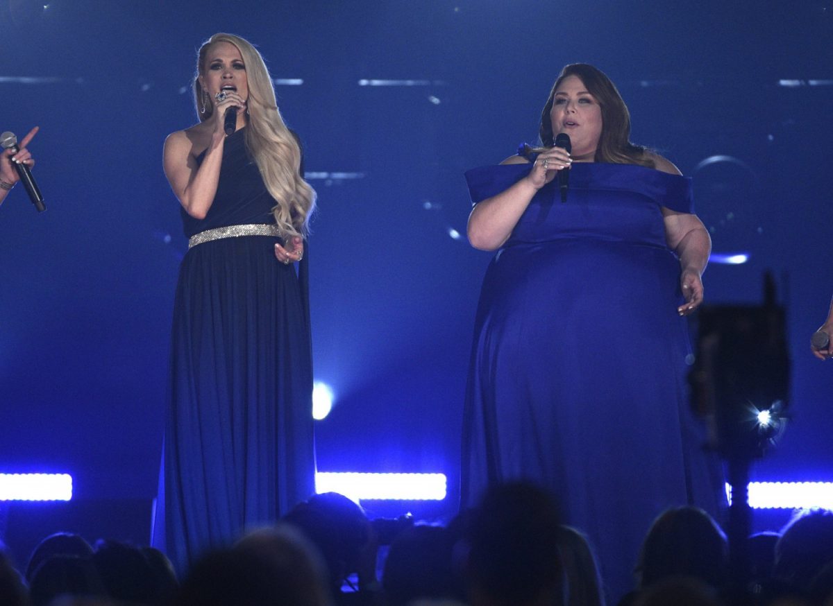 Carrie Underwood left, and Chrissy Metz performs "I'm Standing with You" at the 54th annual Academy of Country Music Awards at the MGM Grand Garden Arena in Las Vegas, on April 7, 2019. (Chris Pizzello/Invision/AP)