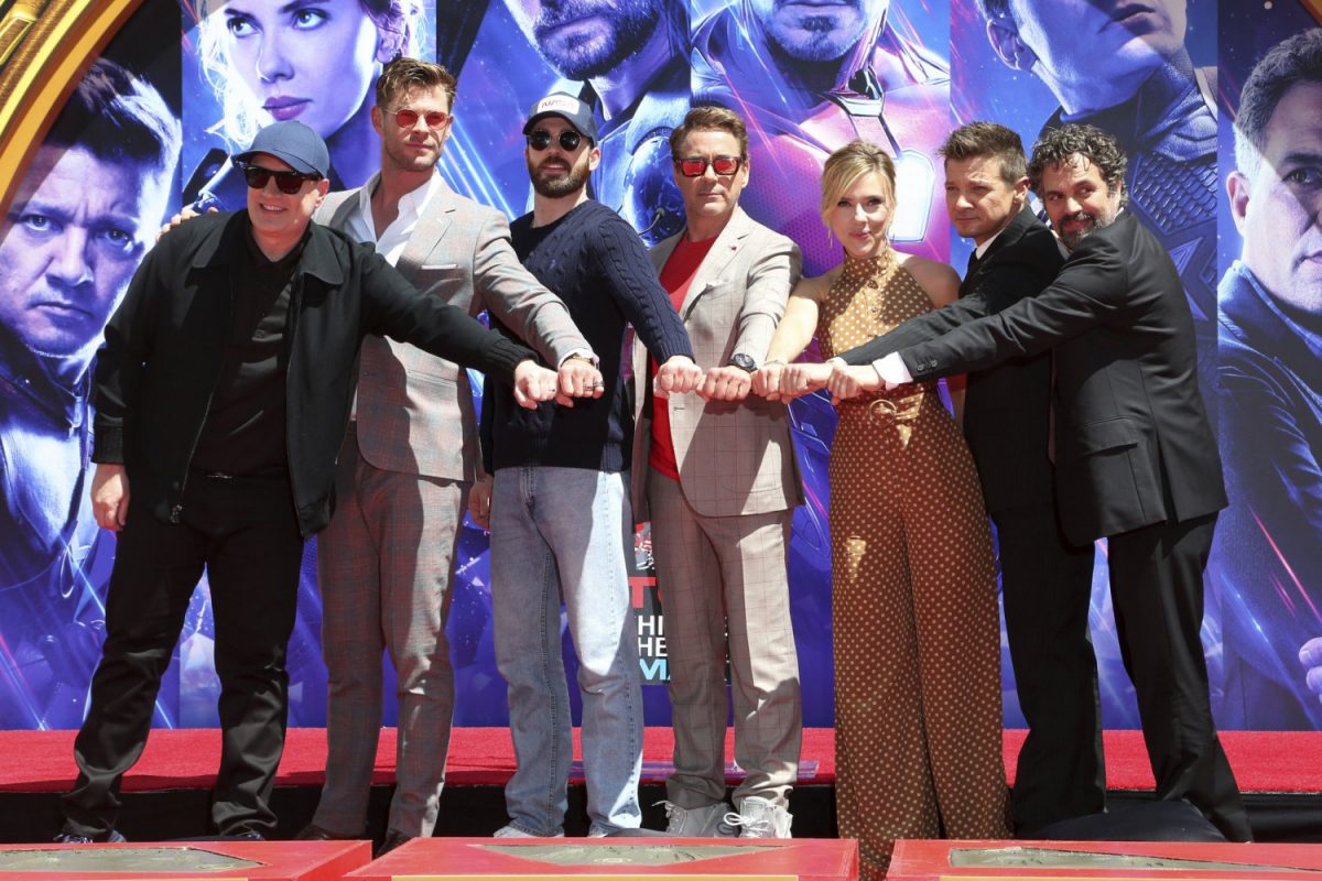 Marvel Studios President Kevin Feige, from left, poses with members of the cast of "Avengers: End Game," Chris Hemsworth, Chris Evans, Robert Downey Jr., Scarlett Johansson, Jeremy Renner and Mark Ruffalo at a hand and footprint ceremony at the TCL Chinese Theatre in Los Angeles on April 23, 2019. (Willy Sanjuan/Invision/AP)