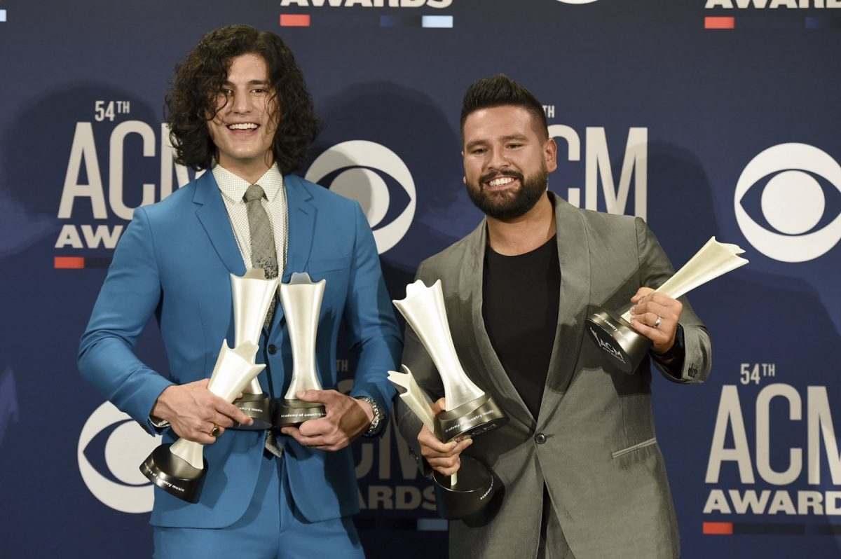 Dan Smyers, left, and Shay Mooney, of Dan + Shay, pose in the press room with the awards for song of the year and single of the year for "Tequila," and duo of the year at the 54th annual Academy of Country Music Awards at the MGM Grand Garden Arena in Las Vegas, on April 7, 2019. (Jordan Strauss/Invision/AP)