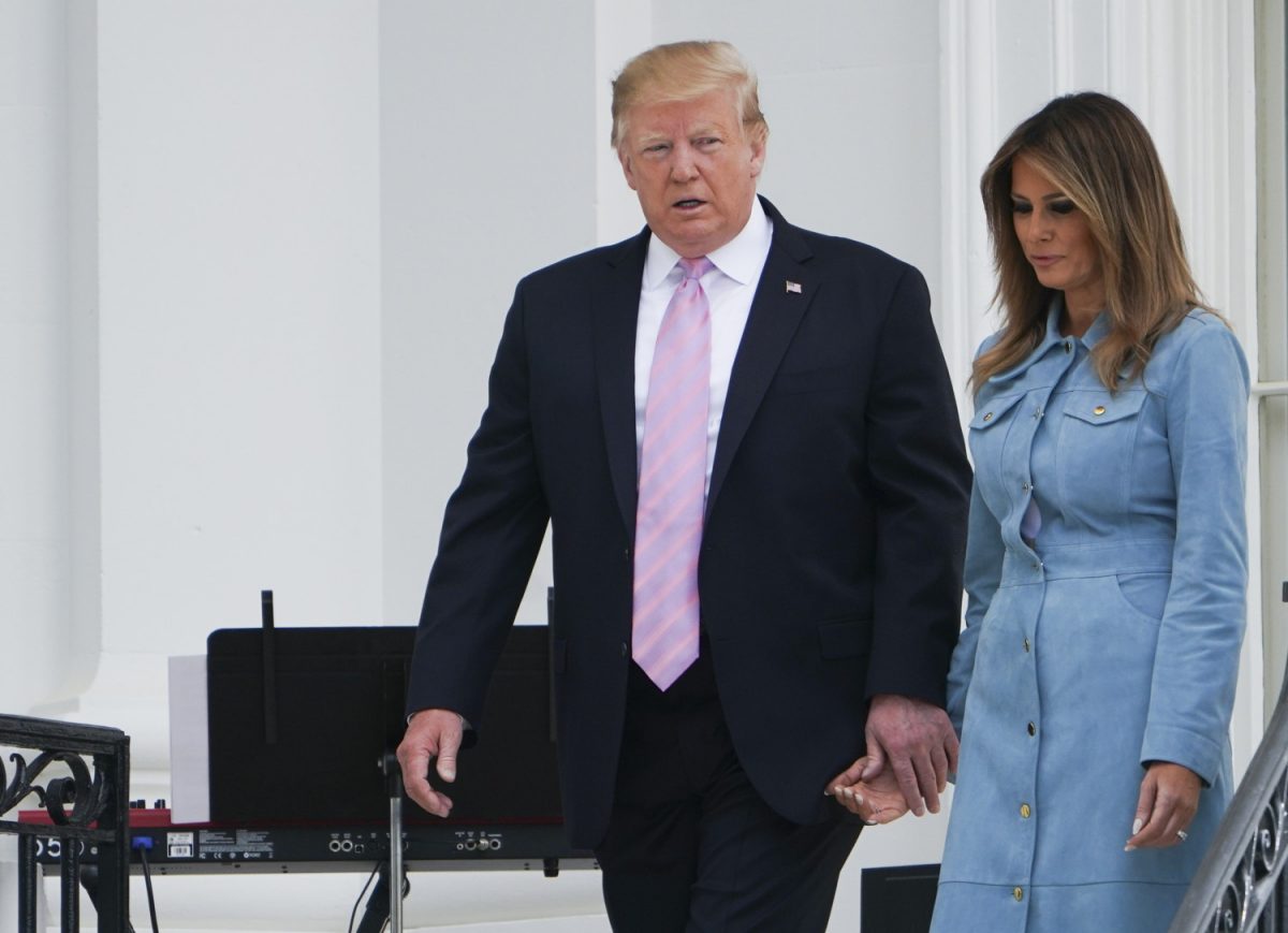 President Donald Trump walks with First Lady Melania Trump during the annual White House Easter Egg Roll on the South Lawn of the White House in Washington, on April 22, 2019. (Mandel Ngan/AFP/Getty Images)