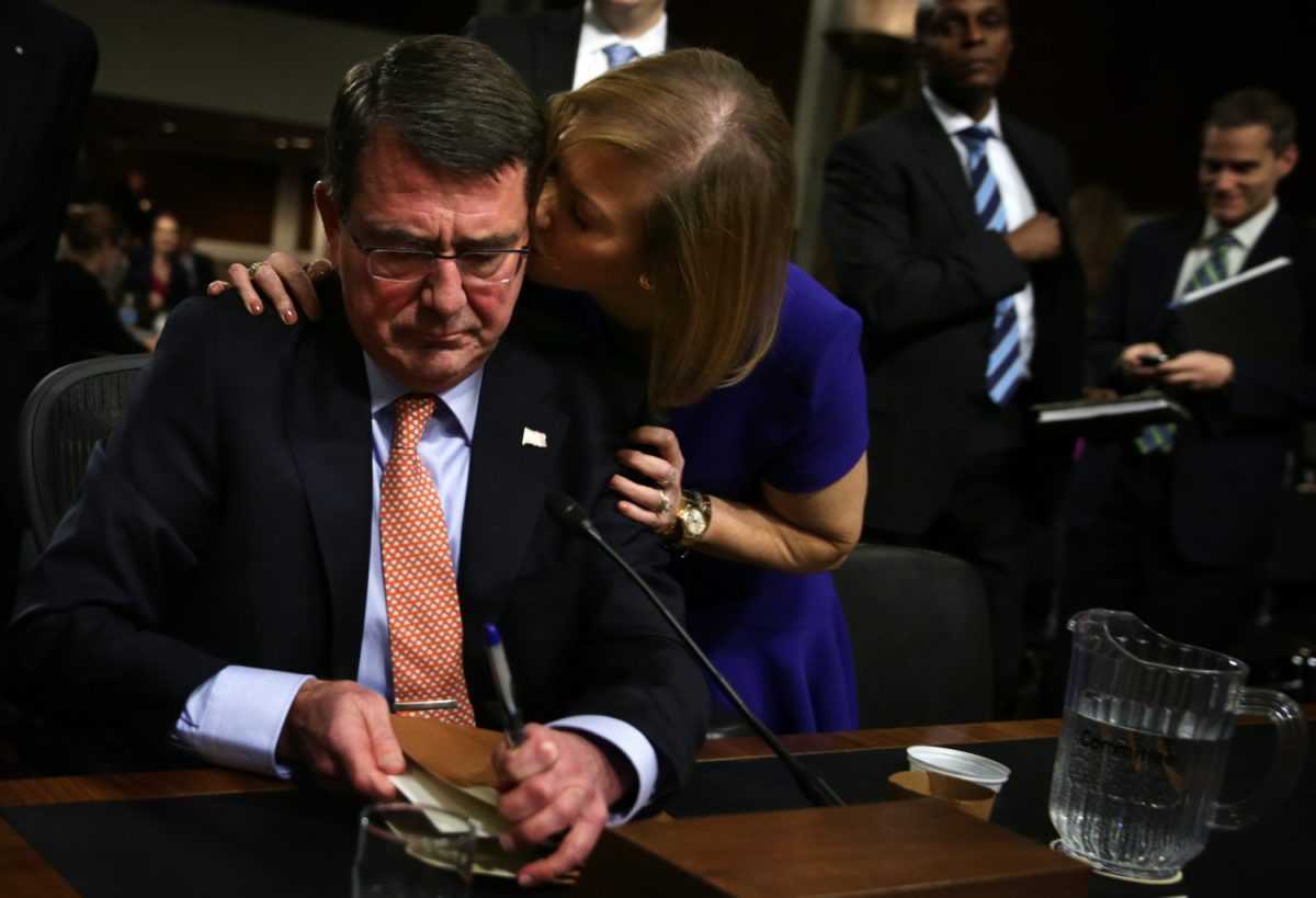 Former Deputy Secretary of Defense Ashton Carter (L) is kissed by his wife Stephanie at the end of his confirmation hearing before the Senate Armed Services Committee, in Washington, on Feb. 4, 2015. (Alex Wong/Getty Images)