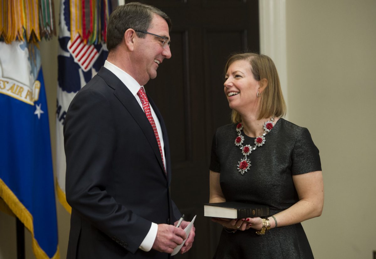 Former Deputy Secretary of Defense Ashton Carter talks with his wife Stephanie before being sworn in at the White House in Washington, Feb. 17, 2015.(SAUL LOEB/AFP/Getty Images)