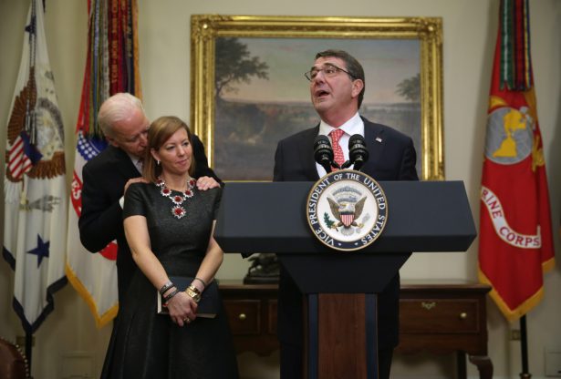 Ashton Carter (R) makes remarks after he was sworn in as secretary of defense as his wife Stephanie (2nd L) and Vice President Joe Biden (L) listen, on Feb. 17, 2015, in the Roosevelt Room of the White House. (Alex Wong/Getty Images)