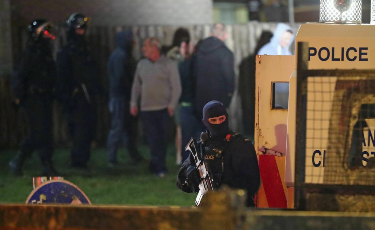 Armed police stage at the scene of unrest in Creggan, Londonderry, in Northern Ireland, on April 18, 2019. (Niall Carson/PA via AP)