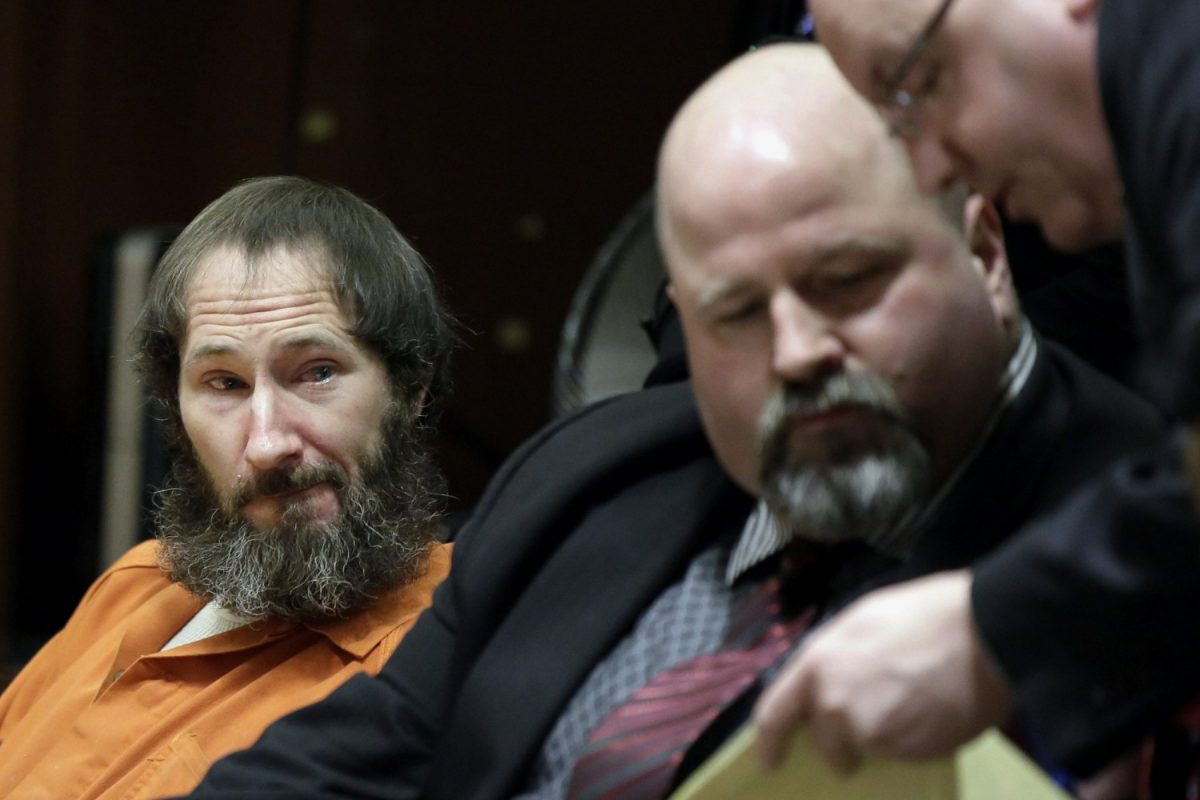 Johnny Bobbitt, left, looks on as his attorney John Keesler and Assistant Prosecutor Andrew McDonnell, right, talk while appearing before Superior Court Judge Christopher Garrenger at the Burlington County Courthouse in Mount Holly on March 8, 2019. (Elizabeth Robertson/The Philadelphia Inquirer via AP)