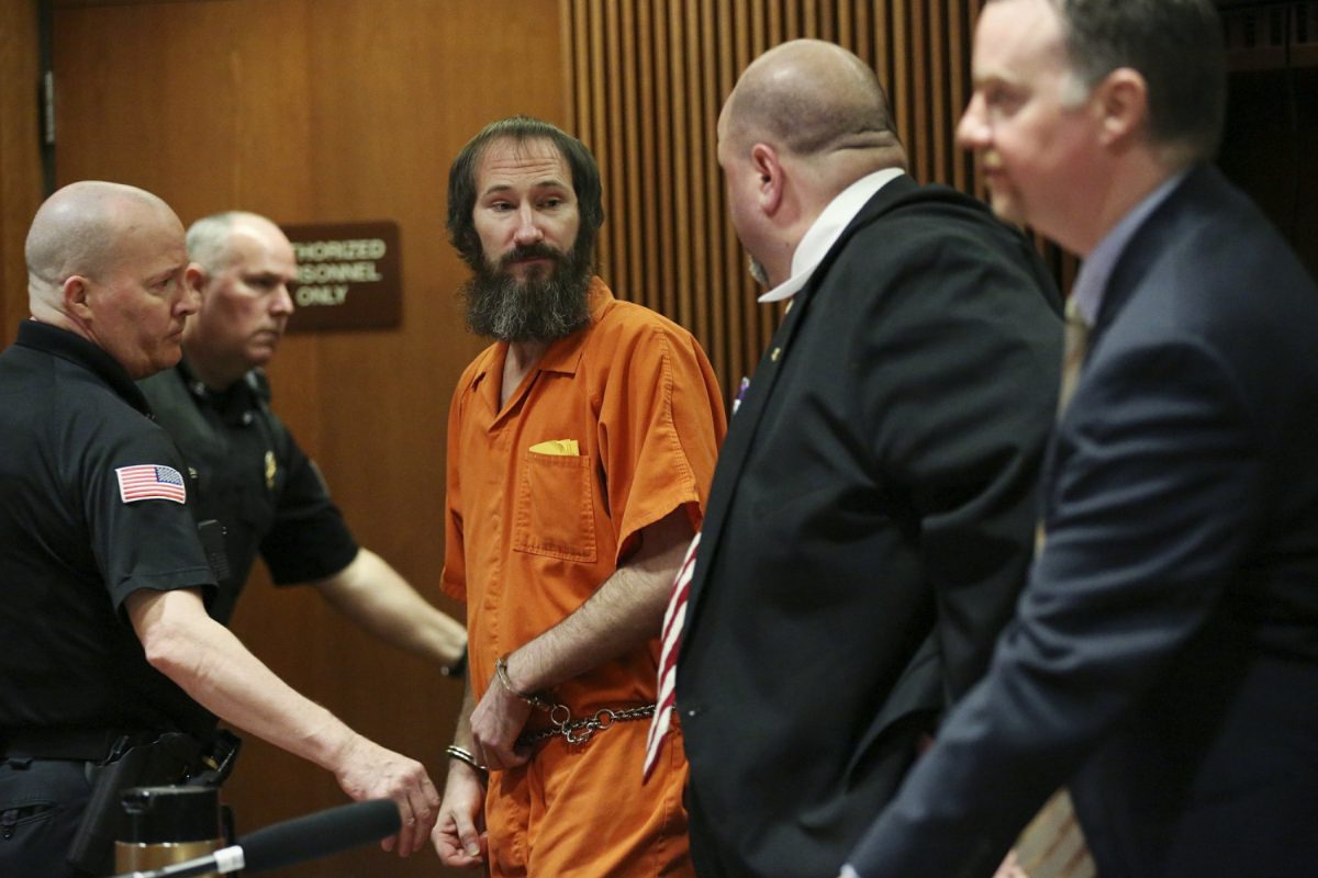 Johnny Bobbitt, center, is led away from his attorneys, John Keesler, second from right, and Stephen P. Hunter, following his sentencing hearing at Burlington County Superior Court in Mount Holly, N.J. on April 12, 2019. (Tim Tai/The Philadelphia Inquirer via AP, Pool)