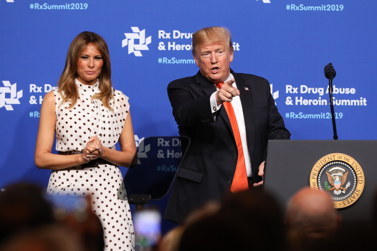 Alongside first lady Melania Trump, President Donald Trump points at members of the audience after a speech at the Rx Drug Abuse & Heroin Summit in Atlanta, Ga., on April 24, 2019. (Jessica McGowan/Getty Images)