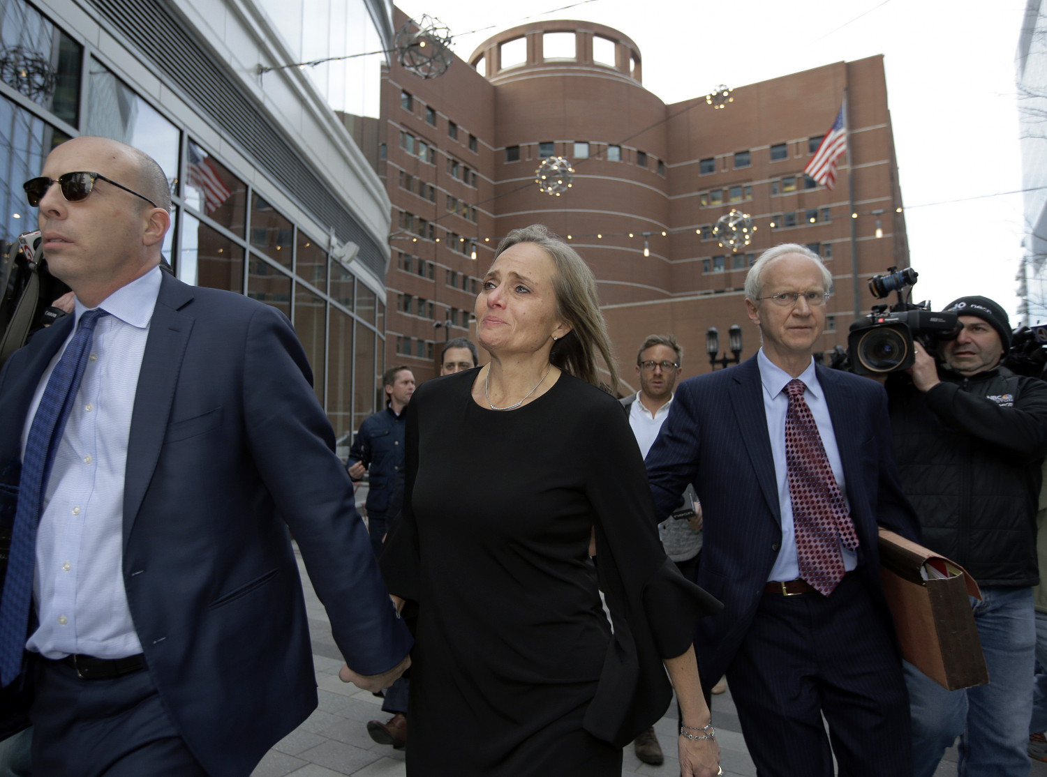 District Court Judge Shelley M. Richmond Joseph (C) departs federal court in Boston, on April 25, 2019, after facing obstruction of justice charges for allegedly helping a man in the country illegally evade immigration officials as he left her Newton, Mass., courthouse after a hearing in 2018. (Steven Senne/AP Photo)