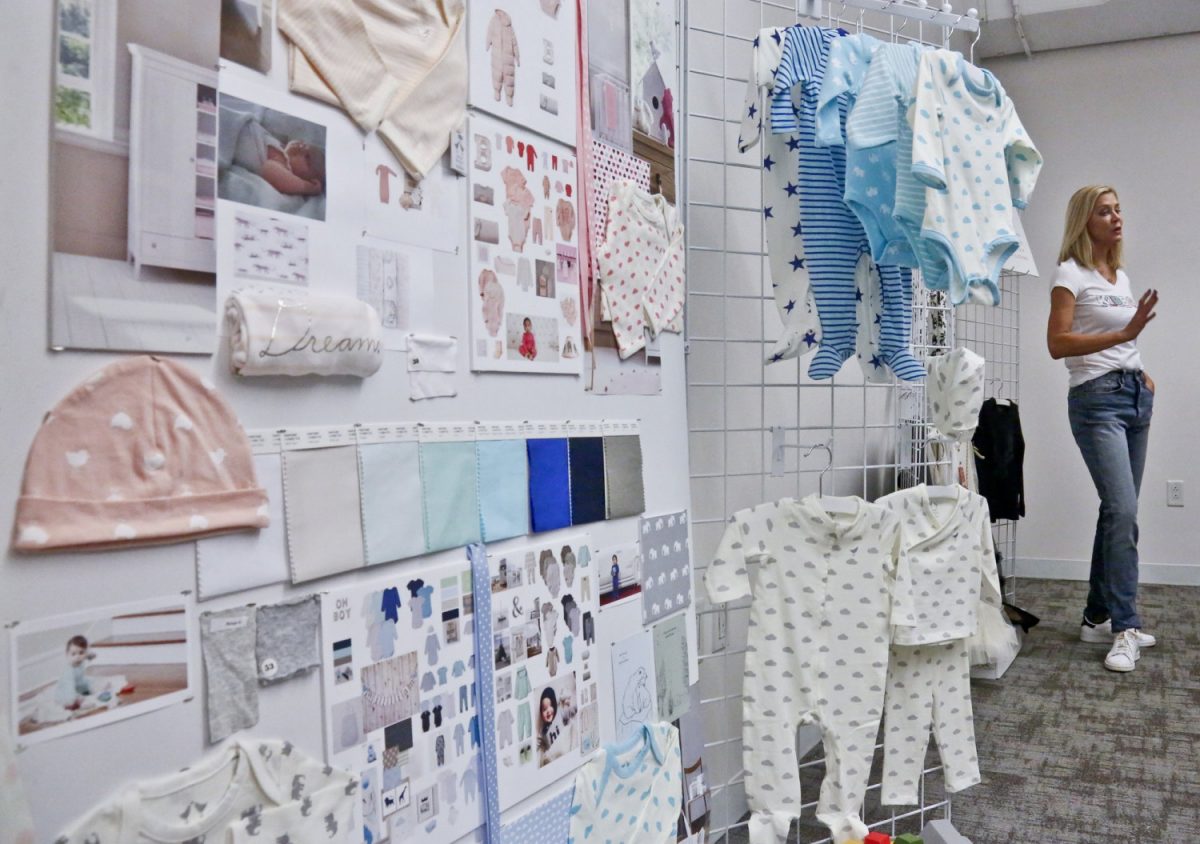 Kidbox CEO Miki Racine Berardelli, shows products for her online styling service for kids, in New York, on April 16, 2019. (Bebeto Matthews/AP photo)