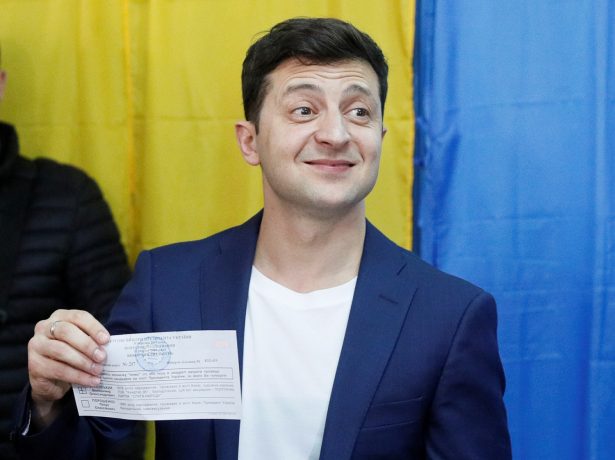 Volodymyr Zelensky demonstrates his ballot while standing in front of the media at a polling station during the second round of a presidential election in Kyiv, Ukraine, on April 21, 2019. (Valentyn Ogirenko/Reuters)