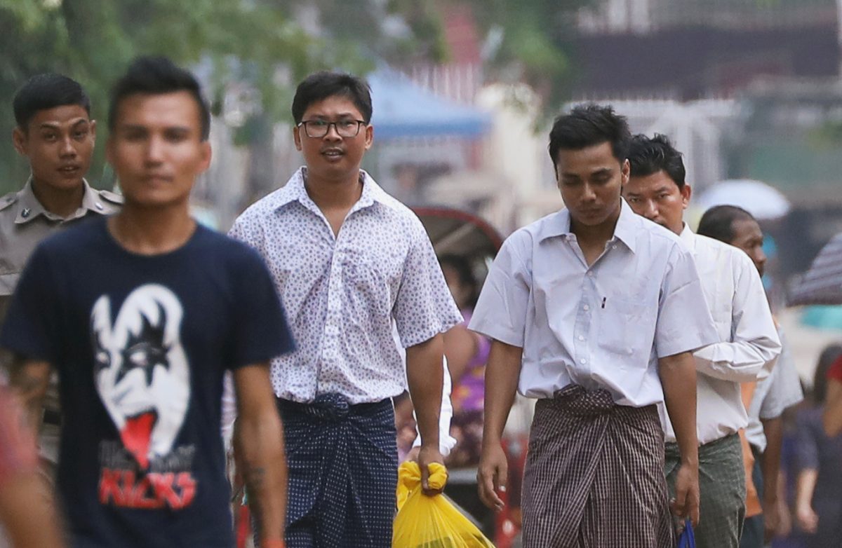 Reuters reporters Wa Lone and Kyaw Soe Oo walk free outside Insein prison after receiving a presidential pardon in Yangon, Myanmar, May 7, 2019. (REUTERS/Ann Wang)