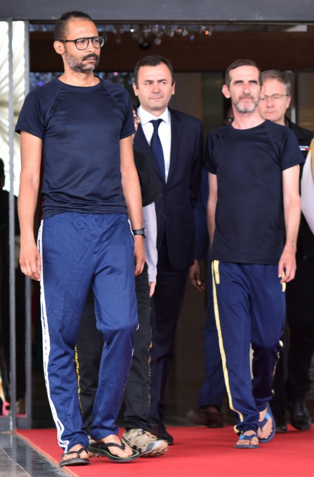 French citizens Laurent Lassimouillas and Patrick Picque, two of of the four rescued hostages, leave after meeting with Burkina Faso President Roch Marc Christian Kabore at the presidential palace in Ouagadougou, Burkina Faso on May 11, 2019 (Anne Mimault/Reuters)
