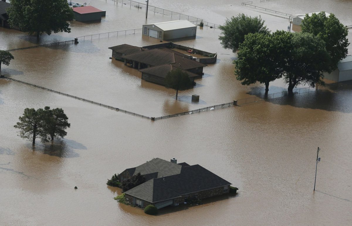 Homes are flooded on the Arkansas River in Tulsa, Okla., on May 24, 2019. (Tom Gilbert/Tulsa World via AP)