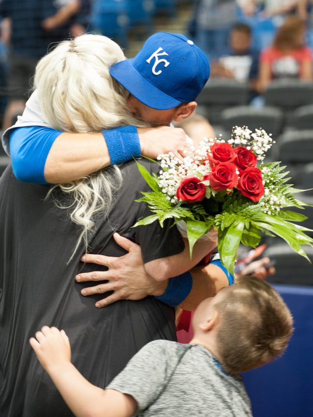 Ben Zobrist #18 of the Kansas City Royals hugs his wife Julianna & son Zion after a video tribute was played for the former Ray to the home crowd before the game in St. Petersburg, Florida, on Aug. 28, 2015. (Cliff McBride/Getty Images)