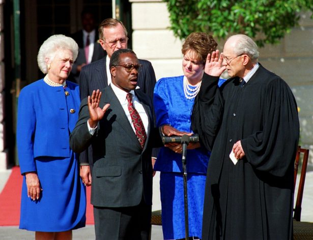 Clarence Thomas is sworn in to the Supreme Court by Justice Byron White in Washington on Oct. 18, 1991. (AP Photo)