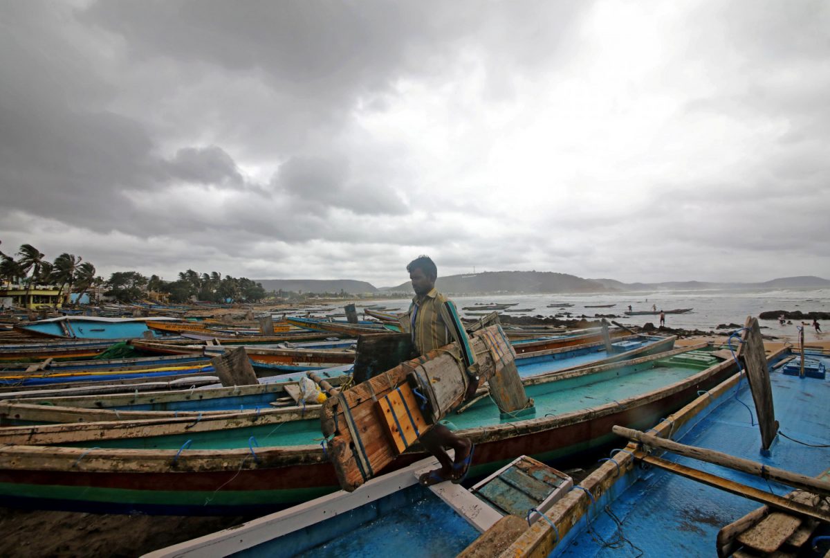 A fisherman carries his tools as he leaves for a safer place after tying his boats along the shore ahead of cyclone Fani in Peda Jalaripeta on the outskirts of Visakhapatnam, India, on May 1, 2019. (Stringer/Reuters)