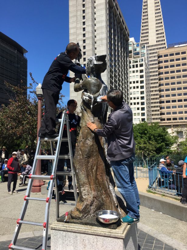 Every year, Bay Area residents clean the replica of the Goddess of Democracy in Portsmouth Square, San Francisco, on May 27, 2019. (Ilene Eng/NTD)