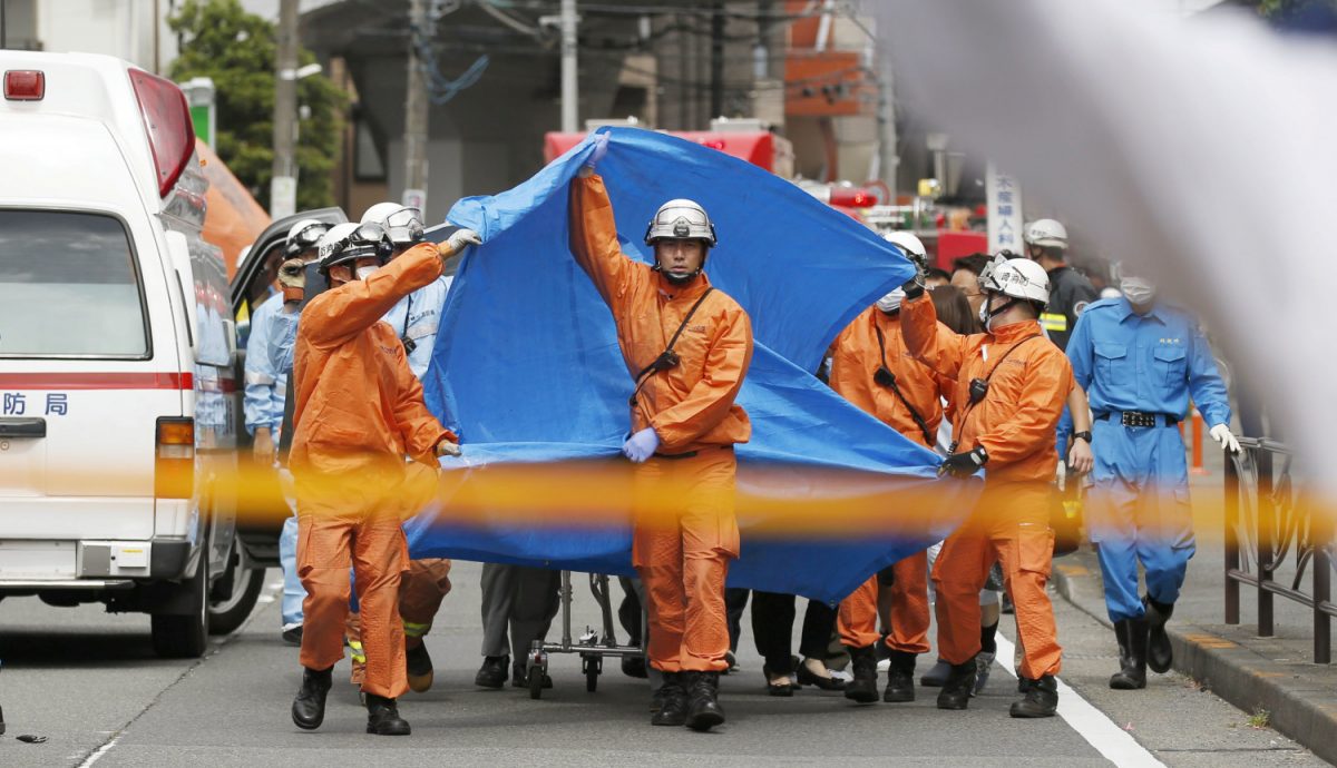 Rescue workers operate at the site where sixteen people were injured in a suspected stabbing by a man, in Kawasaki, Japan on May 28, 2019. (Kyodo/via Reuters)