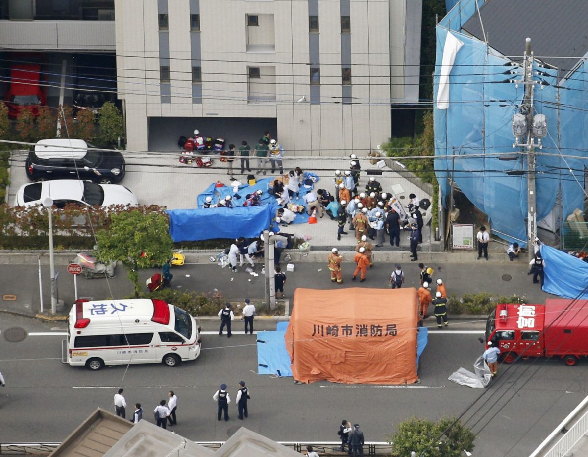 Rescue workers operate at the site where sixteen people were injured in a suspected stabbing by a man, in Kawasaki, Japan on May 28, 2019. (Kyodo/via Reuters)