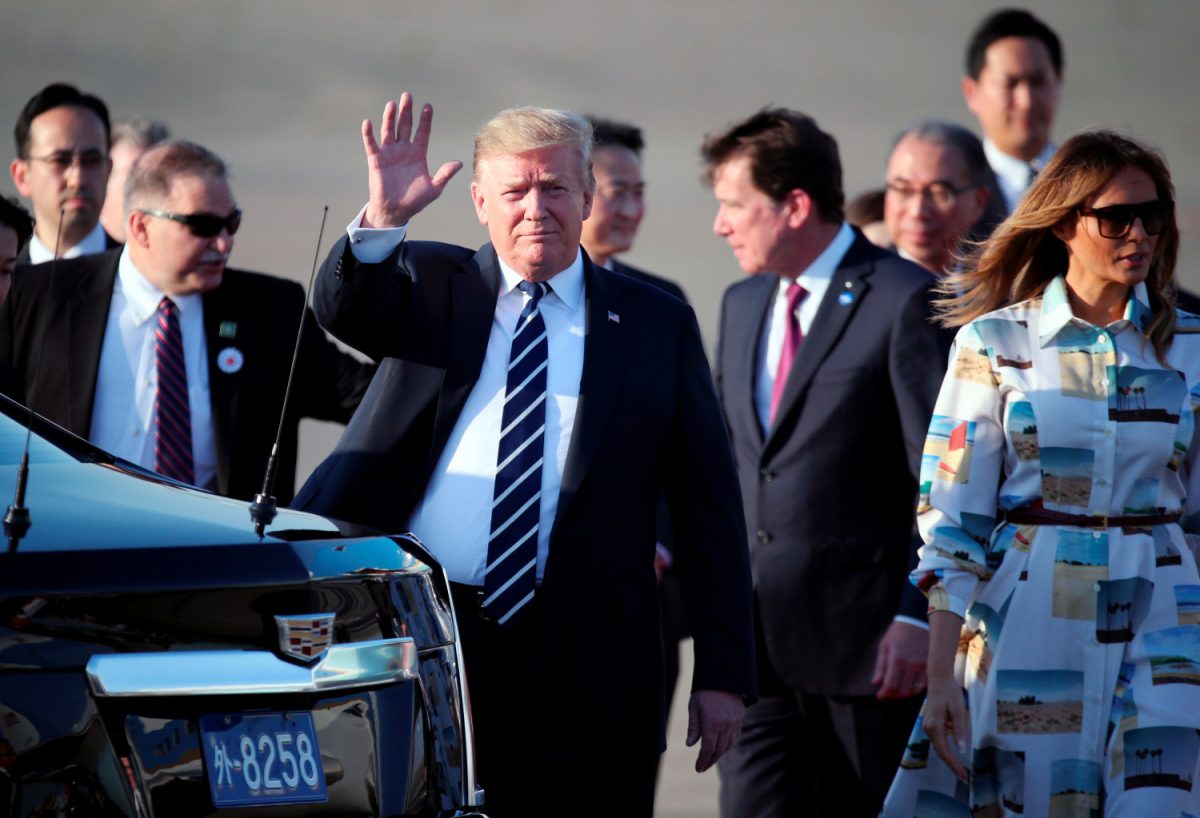 President Donald Trump waves as he arrives at the Haneda International Airport in Tokyo, Japan on May 25, 2019. (Koji Sasahara/Pool via Reuters)