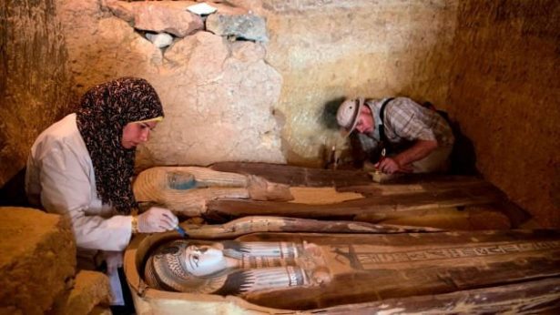 Excavation workers inside the tomb. (Mahmoud Khaled/AFP/Getty Images)